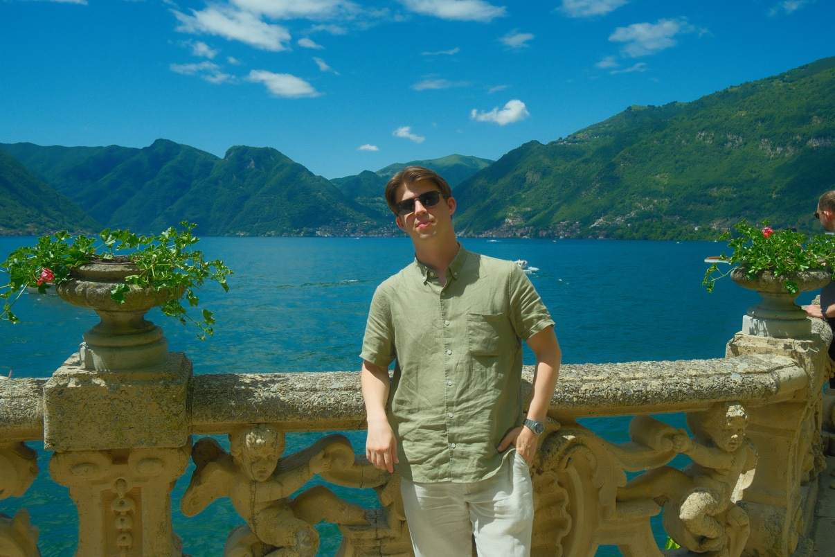 Brendan on the carved stone balustrade terrace above Lake Como at Villa del Balbianello