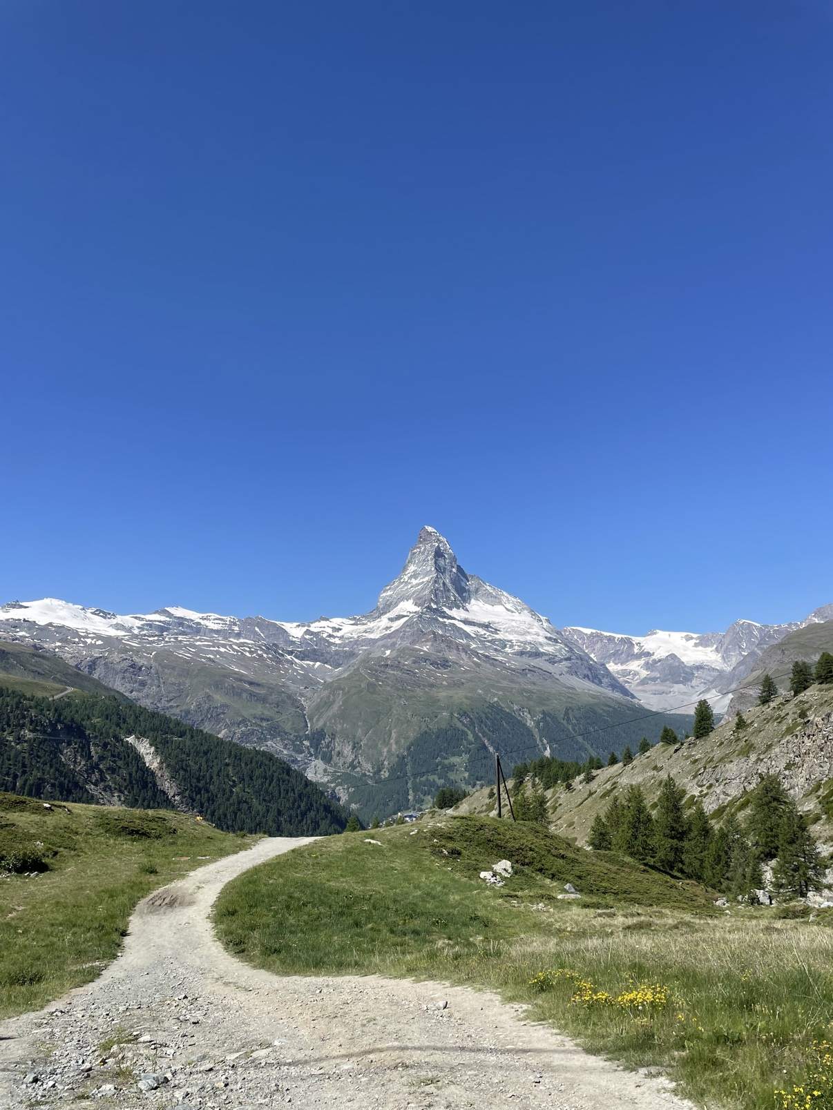 A hiking trail curving toward the Matterhorn above Zermatt